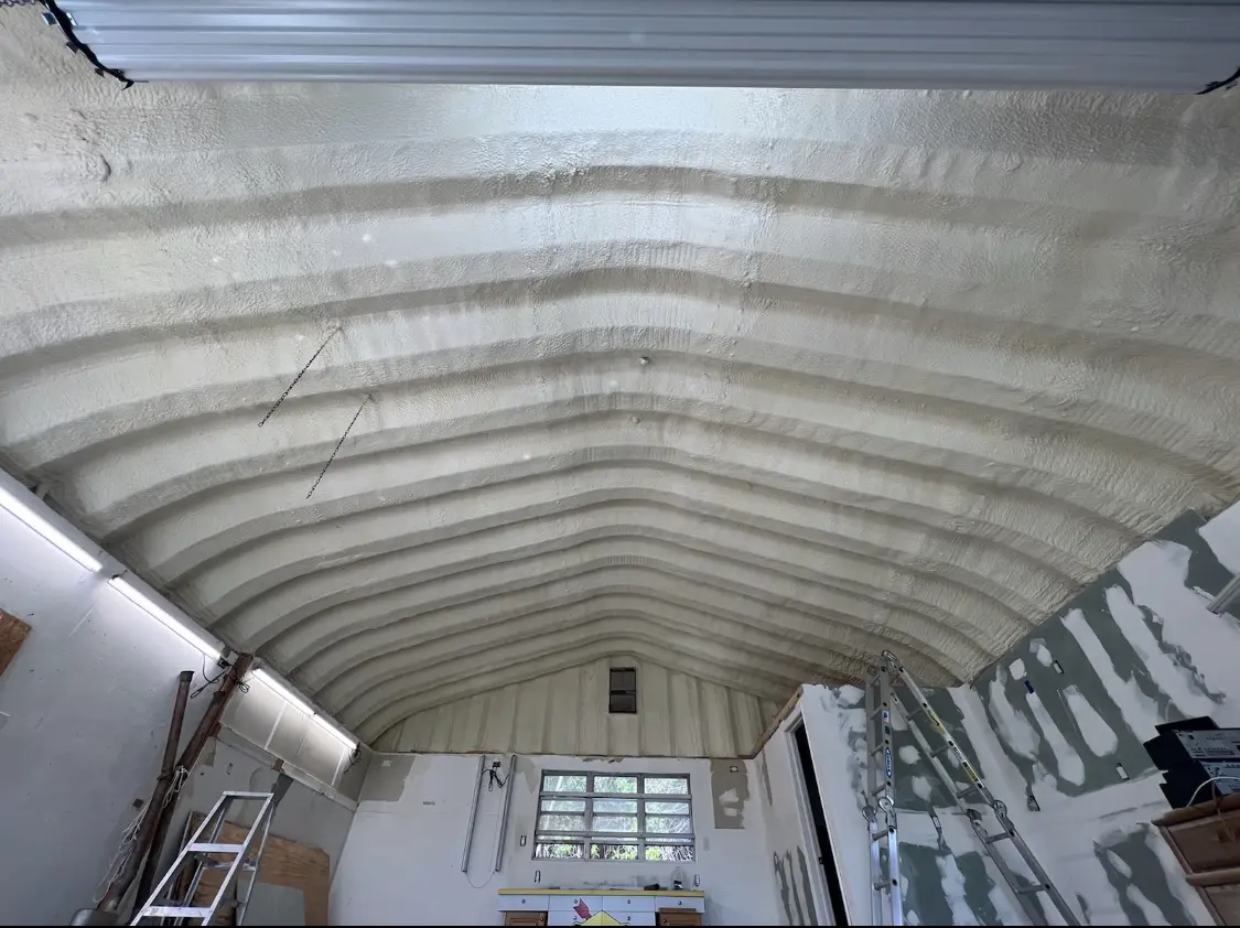 Spray polyurethane foam applied to the underside of a metal roof deck in Uniontown